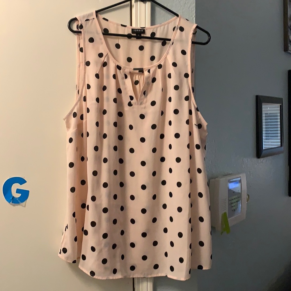 Pink and black sleeveless blouse